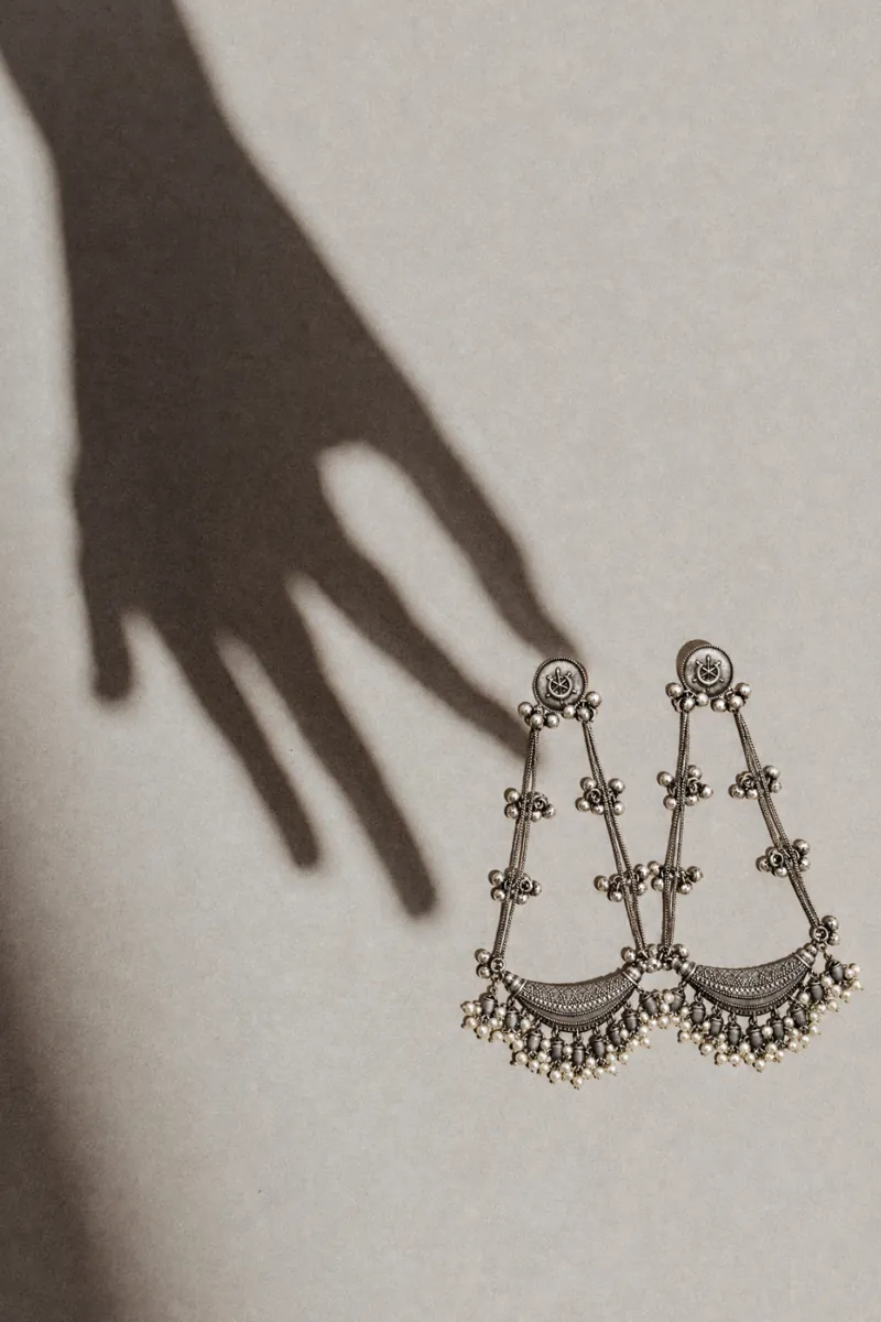 Handcrafted oxidised silver dangler earrings with pearl detailing